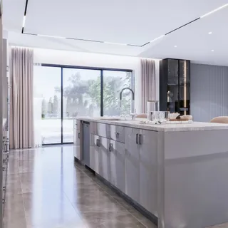 Modern white kitchen island and cabinetry in a bright open room