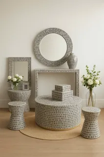 Woven stools, tables, baskets and wall mirrors arranged in an interior