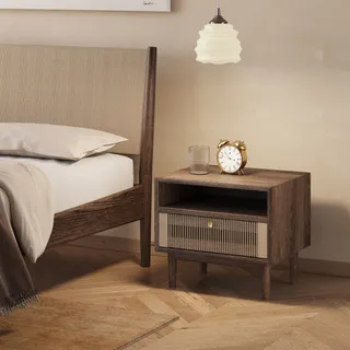 Woven-front bedside table beside a wooden bed with woven headboard