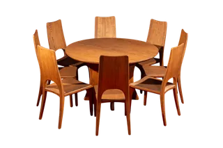 Round wooden dining table surrounded by six matching wooden chairs.