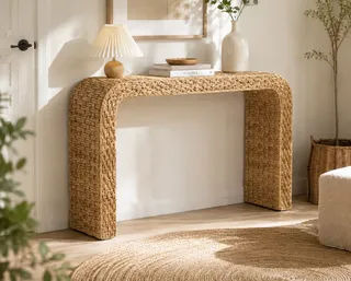 Woven console table against a sunlit wall