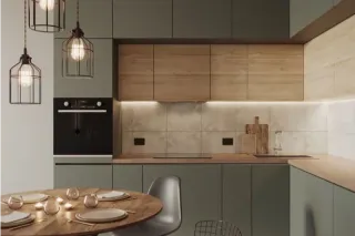Modern kitchen with wood upper cabinets, green lower cabinets and a round dining table.