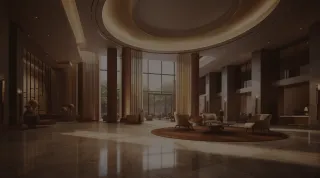 Furnished luxury interior with lounge seating, a large window and warm wood finishes.