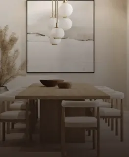 Light wood dining table and upholstered chairs beneath clustered pendant lights.