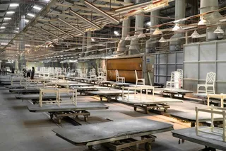 Tan Thanh Furniture upholstery production floor with rows of unfinished seating frames