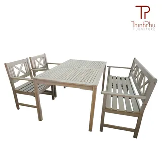 White wooden outdoor dining table with two chairs and a bench