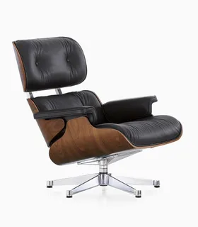 Black leather lounge chair with curved wooden shell and metal swivel base