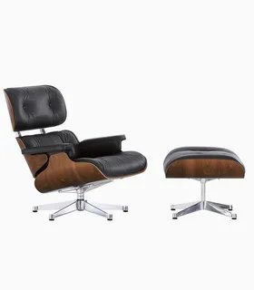 Black leather lounge chair and matching ottoman with wooden shells