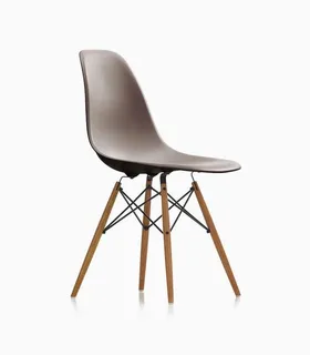 Brown molded shell chair with wooden legs and metal supports