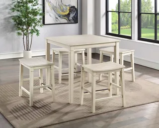 Light-painted dining table with matching stools in a furnished room