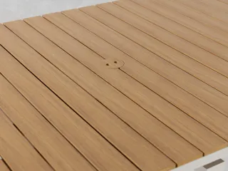 Close-up of a slatted wooden tabletop with a central folding mechanism