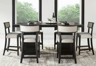 Black dining table with matching chairs in a modern dining room