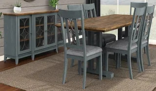 Gray dining table and chairs beside a matching glass-front sideboard