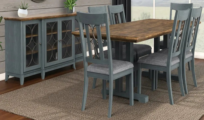 Gray dining table and chairs beside a matching glass-front sideboard