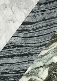 Close-up of white and dark veined stone slabs.