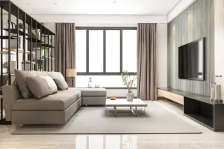 Modern living room with sectional sofa, television console and coffee table