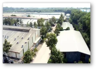 Aerial view of industrial factory buildings, warehouses and internal access roads