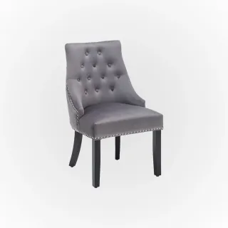 Gray tufted upholstered chair with black wooden legs