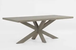 Rectangular wood dining table with crossed geometric pedestal legs.