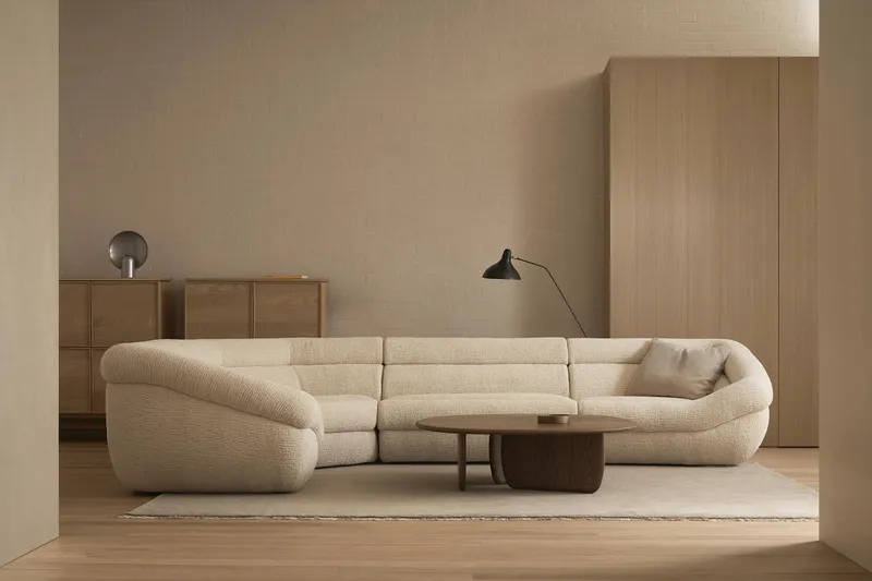 Wooden lounge chair with a brown leather seat and draped leather backrest