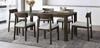 Dark wood dining table with six upholstered chairs
