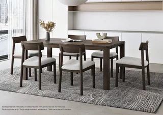 Dining table with six upholstered chairs in a modern room