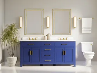 Blue bathroom vanity with brass hardware, two sinks and matching framed mirrors