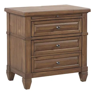 Brown wooden four-drawer chest with paneled fronts and tapered feet